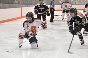 Holly Carrie-Mattimoe drops to a knee in the Syracuse's 4-1 win over Lindenwood. The forward scored a third-period goal on her Senior Night.