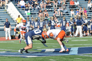 Chris Daddio knocks a draw backward in Syracuse's 9-3 win over Notre Dame on Saturday. Syracuse won only 2-of-24 draws in its loss to Villanova during the regular season.