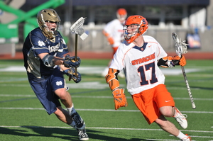 Dylan Donahue eludes a Notre Dame defender during Syracuse's 9-3 win over the Fighting Irish in the Big East tournament semifinals on Thursday. Donahue scored one goal in the game.