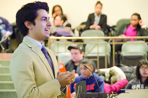 Boris Gresely, president of the Student Association, addresses the assembly at Monday night's meeting. The assembly passed a bill which will allow SA to create a committee to review the organization's operating budget. 