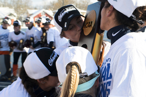 Syracuse field hockey players kissed the trophy after winning the national championship. Their title helped SU have at least the second most successful school year since 2001-02.