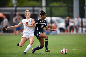 Sydney Brackett, pictured on left, scored a goal and added an assist in SU's win Monday.