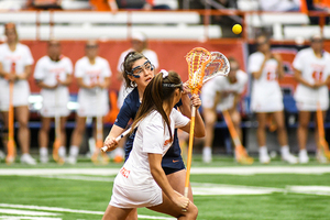 Braelie Kempney battles for a draw in Syracuse's matchup with Virginia.