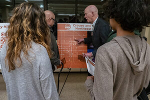 Greg Loh, Chief Policy Officer at the Office of the Mayor, explains the new I-81 Community Grid Vision Plan to attendees at a city open house. The discussion included a feedback session where residents expressed their questions and concerns.
