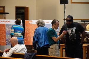 Community members gather at Tucker Missionary Baptist Church to discuss plans for city infrastructure following the removal of the I-81 viaduct. Joe Driscoll presented sketches for future Syracuse streets after the destruction of the viaduct, prompting community discussion.