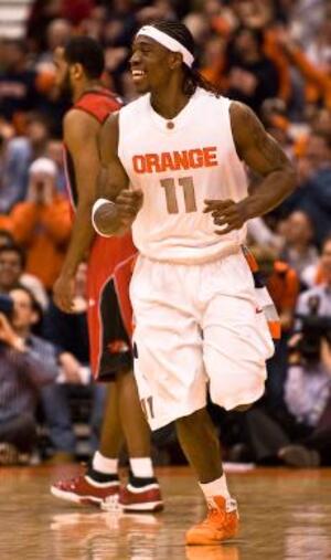 Paul Harris smiles during Syracuse's blowout victory over Rutgers Tuesday. Harris scored a season-high 18 points and grabbed nine rebounds in the win. 