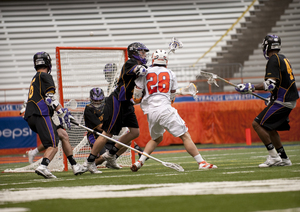 Stephen Keogh (28) makes a shot attempt in the Syracuse men's lacrosse team's 15-8 victory over Albany Saturday.