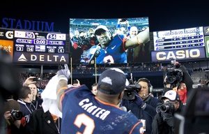 Delone Carter walks onto the Yankee Stadium field in triumph after SU's Pinstripe Bowl victory over Kansas State Thursday.