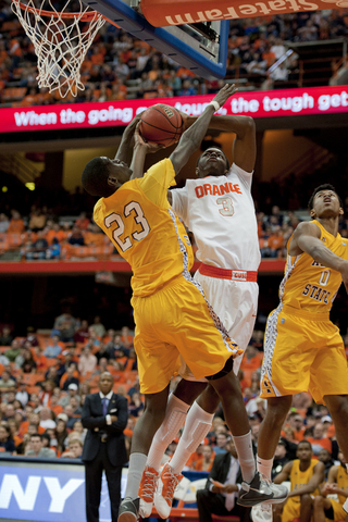 Jerami Grant leaps through traffic to attempt a contested layup.