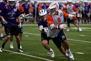 Syracuse midfielder JoJo Marasco works around a defender.