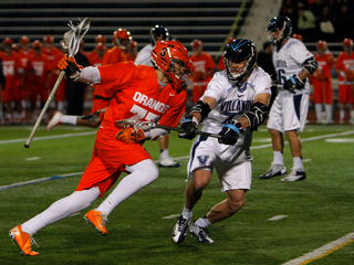 Henry Schoonmaker runs past Villanova midfielder Remington Pope.