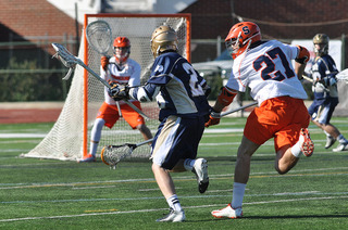 Sean Young pressures a shooting Fighting Irish player. The Orange defense held the Fighting Irish scoreless for 35:19.