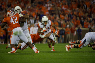 SU running back Prince-Tyson Gulley is brought down on a tackle. 