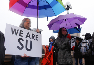 Dr. Nicole Lynk and Nicole Schwartz, graduate assistants in the David B. Falk College of Sport and Human Dynamics stand outside the Hall of Languages during a protest held to support THE General Body. 