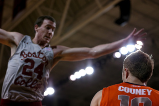 Clifford extends his arms to guard Trevor Cooney's inbounds pass from out of bounds.