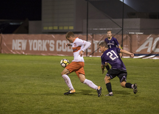 Freshman midfielder Simon Triantafillou corrals the ball. 