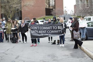 Student protestors line up in front of Gate E to greet admitted students and parents on campus. 