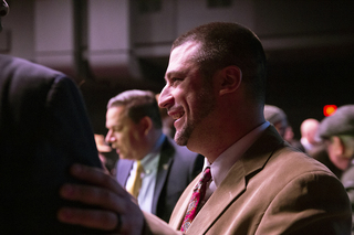 Common Councilor Joe Driscoll, of the 5th district, looks on during Walsh's 