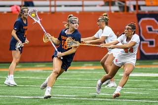 Mary Rahal checks a player on defense.